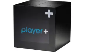 Czarny, sześcienny odtwarzacz multimedialny Player+. Dowiedz się, delta media player ile kosztuje.